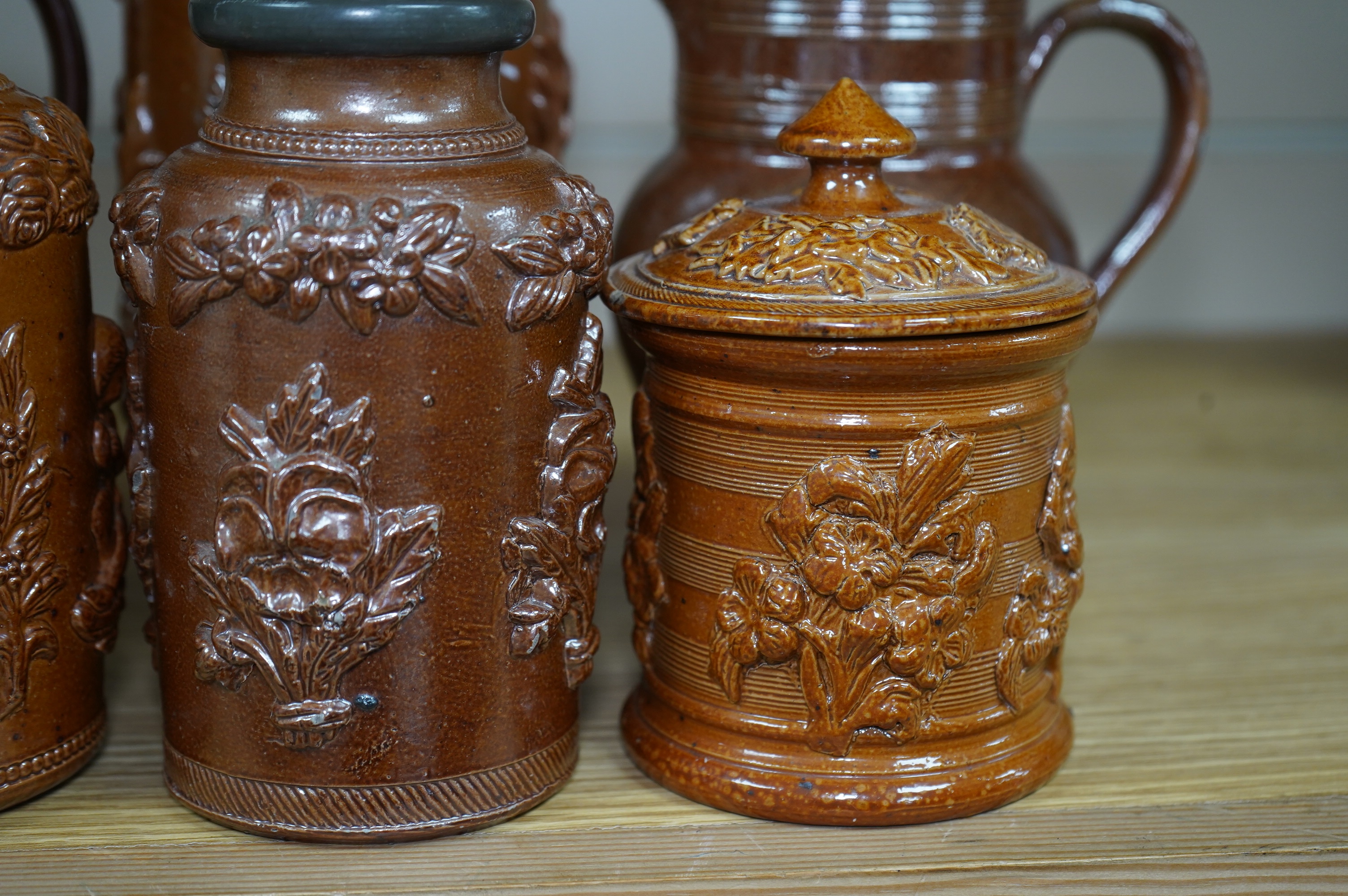 Four 19th century Derbyshire lead glazed stoneware jars and a stoneware jug and another, tallest 21cm (6). Condition - poor to fair